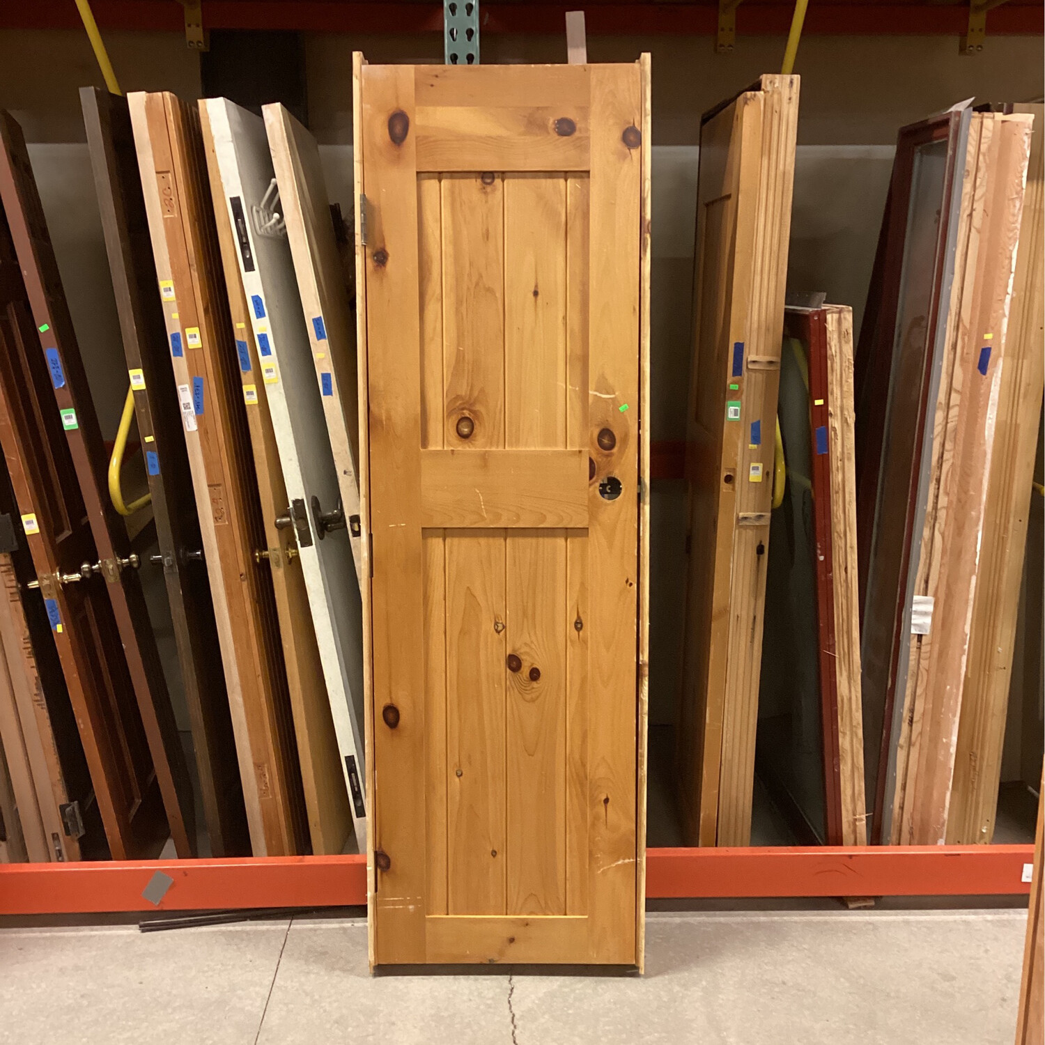 23.75” x 80” 2 panel light brown door 