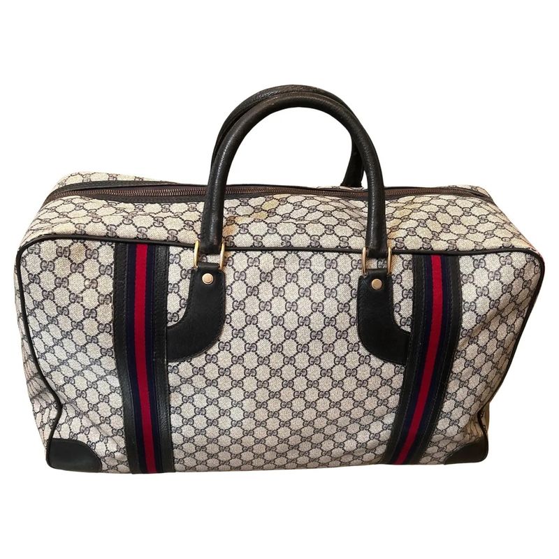 An Iconic 1980s Gucci Vintage Monogram Canvas Travel Bag