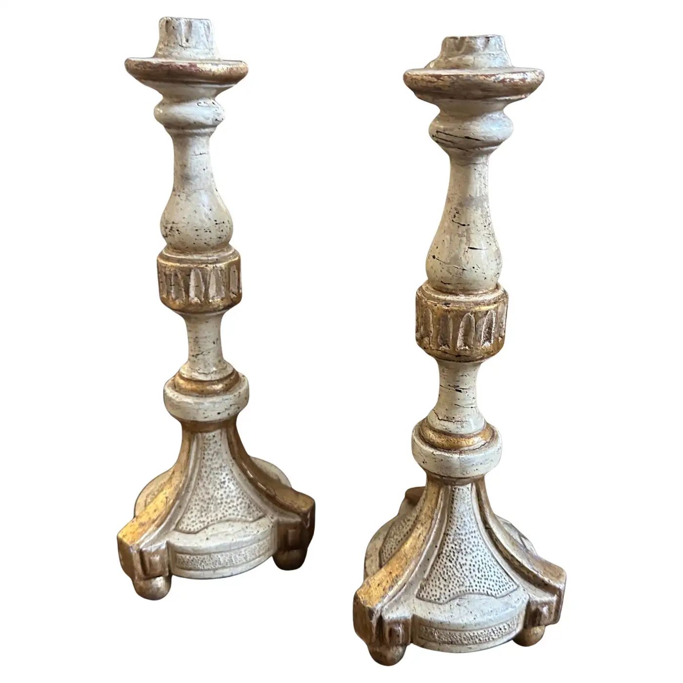 A pair of Louis XVI White and Gold Lacquered Wood Sicilian Candlesticks