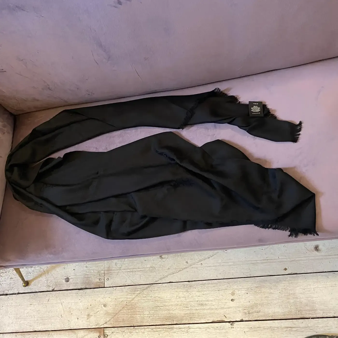 A Never Used Black Wool Scarf by Gucci with Continuous Logo