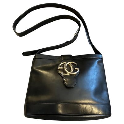 An Elegant 1970s Black Leather and Brass Bucket Shoulder Bag by Gucci
