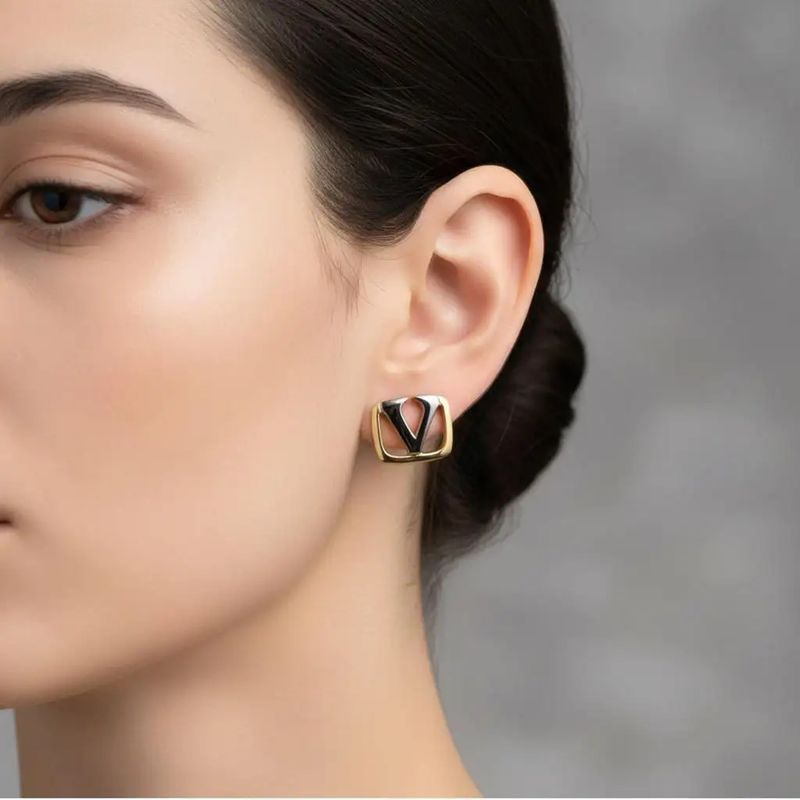 1980s Logo Gilted Metal Clip On Earrings by Valentino Garavani