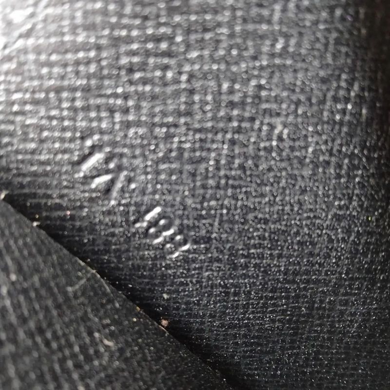 A 1993 Louis Vuitton Jena Black Epi Leather Clutch in Excellent Condition