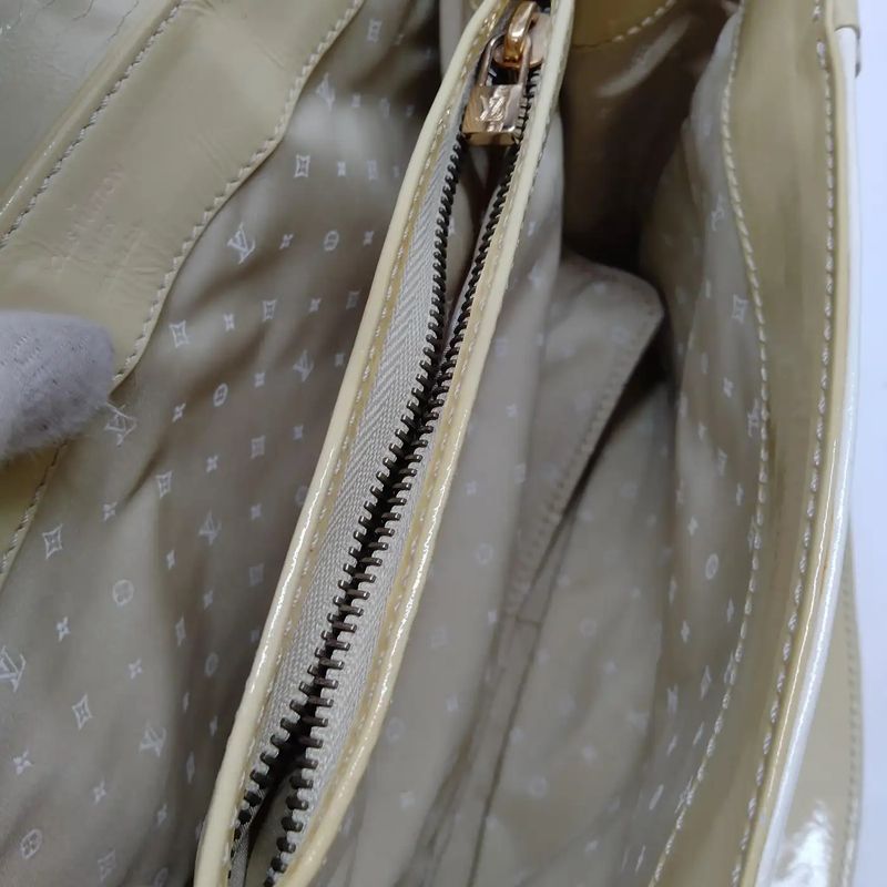 A Vintage Louis Vuitton Beige and White Leather Cruise Hand-Bag