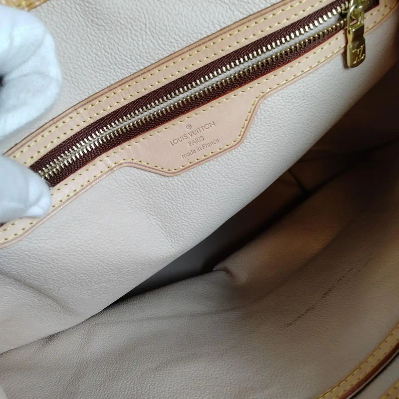 A 2006 Louis Vuitton Monogram Coated Canvas and Leather Bucket GM Tote Bag