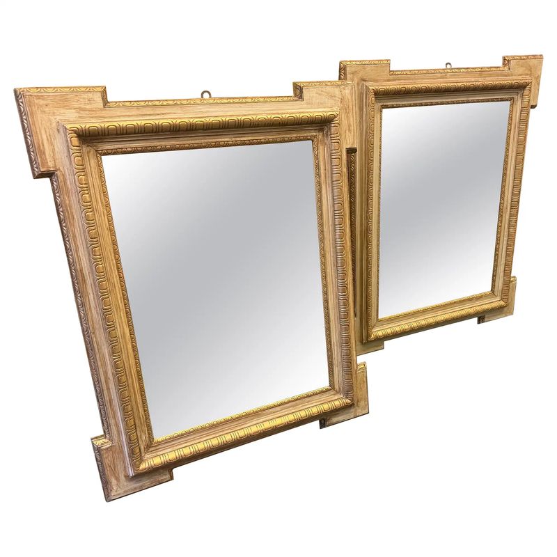 A Pair of Neoclassical Italian Wall Mirrors in Pickled and Gilded Wood.