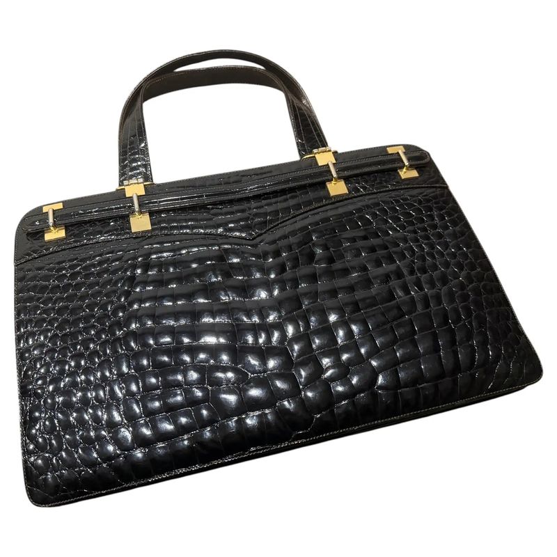 1970s Vintage Glossy Embossed Black Leather and Brass Italian Hand Bag