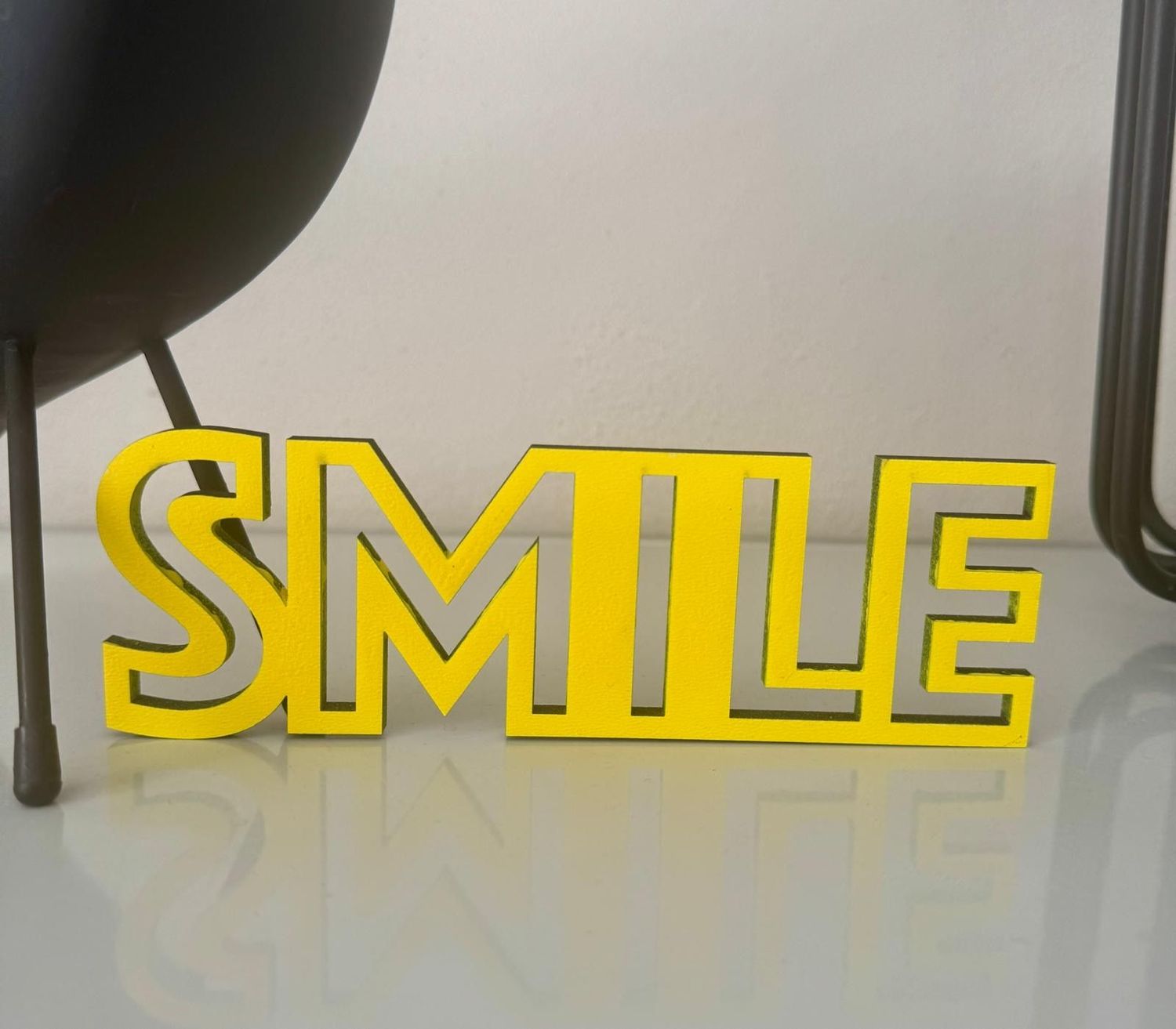 Schriftzug "SMILE"