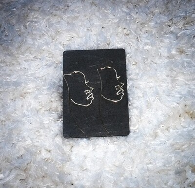 Gold tone Indie face earrings