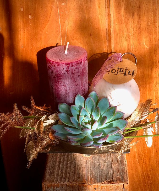 Arrangement avec bougie