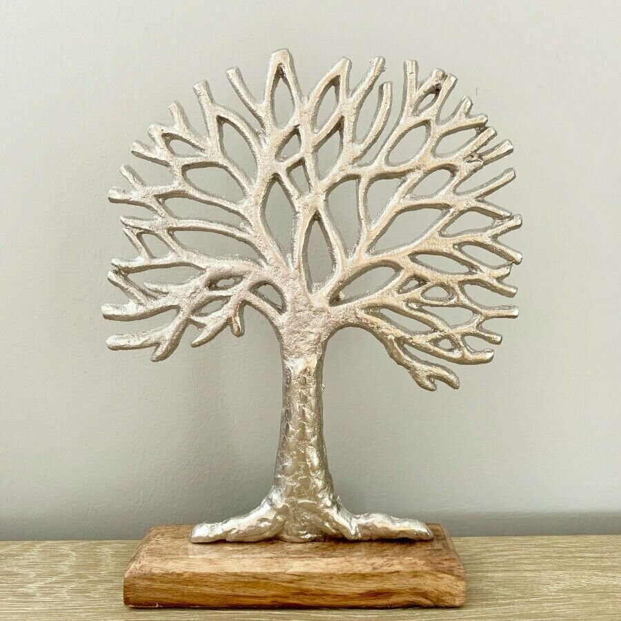 Shabby chic hammered metal Tree of Life ornament on wood base.