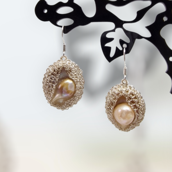 16 Silver earrings with rear &quot;blister&quot; pearls embedded in CroShaped© wire pattern.