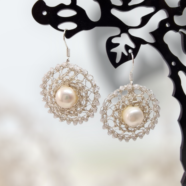 16 Silver Earrings with pearls and cubic zirconia embedded in CroShaped© wire pattern.