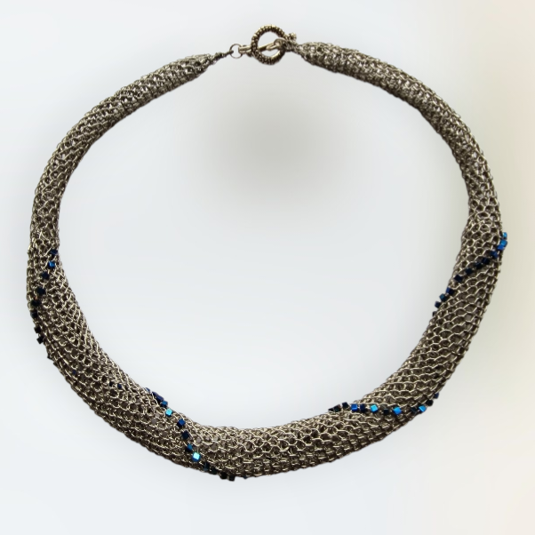 Platinum Necklace &quot;Platinum World&quot; with hematite hand CroShaped© in signature wire pattern.