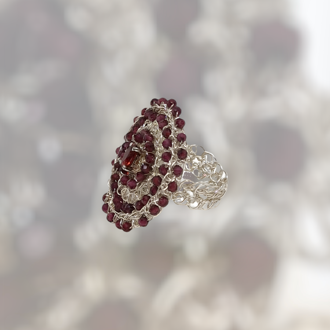 Silver Ring &quot;Gems Donor&quot; with garnet hand CroShaped© in signature wire pattern.