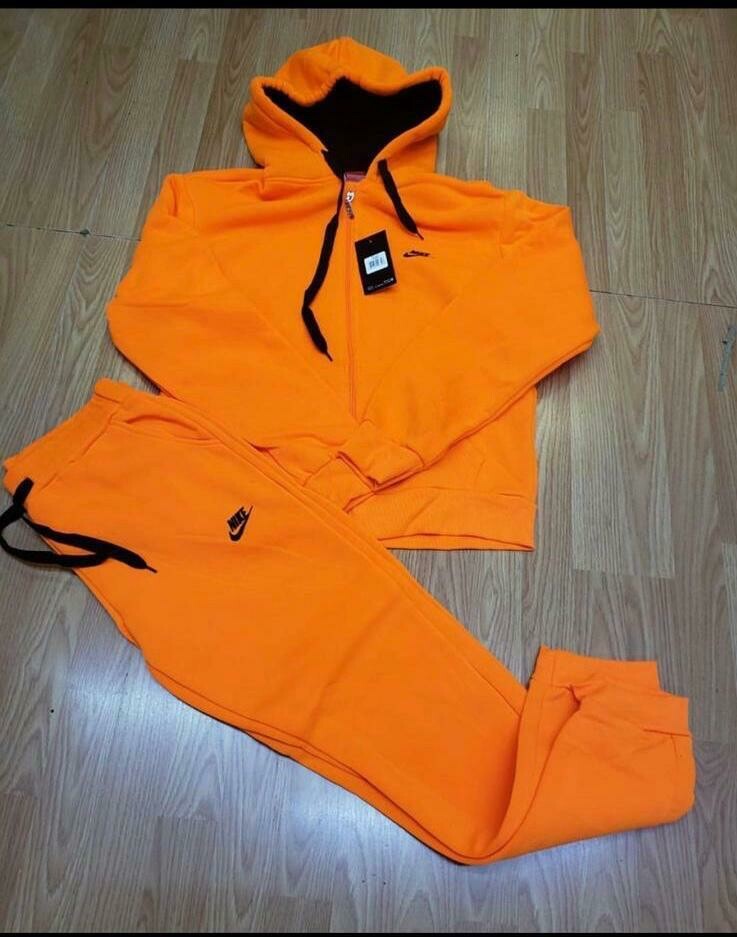 orange nike jogging suit