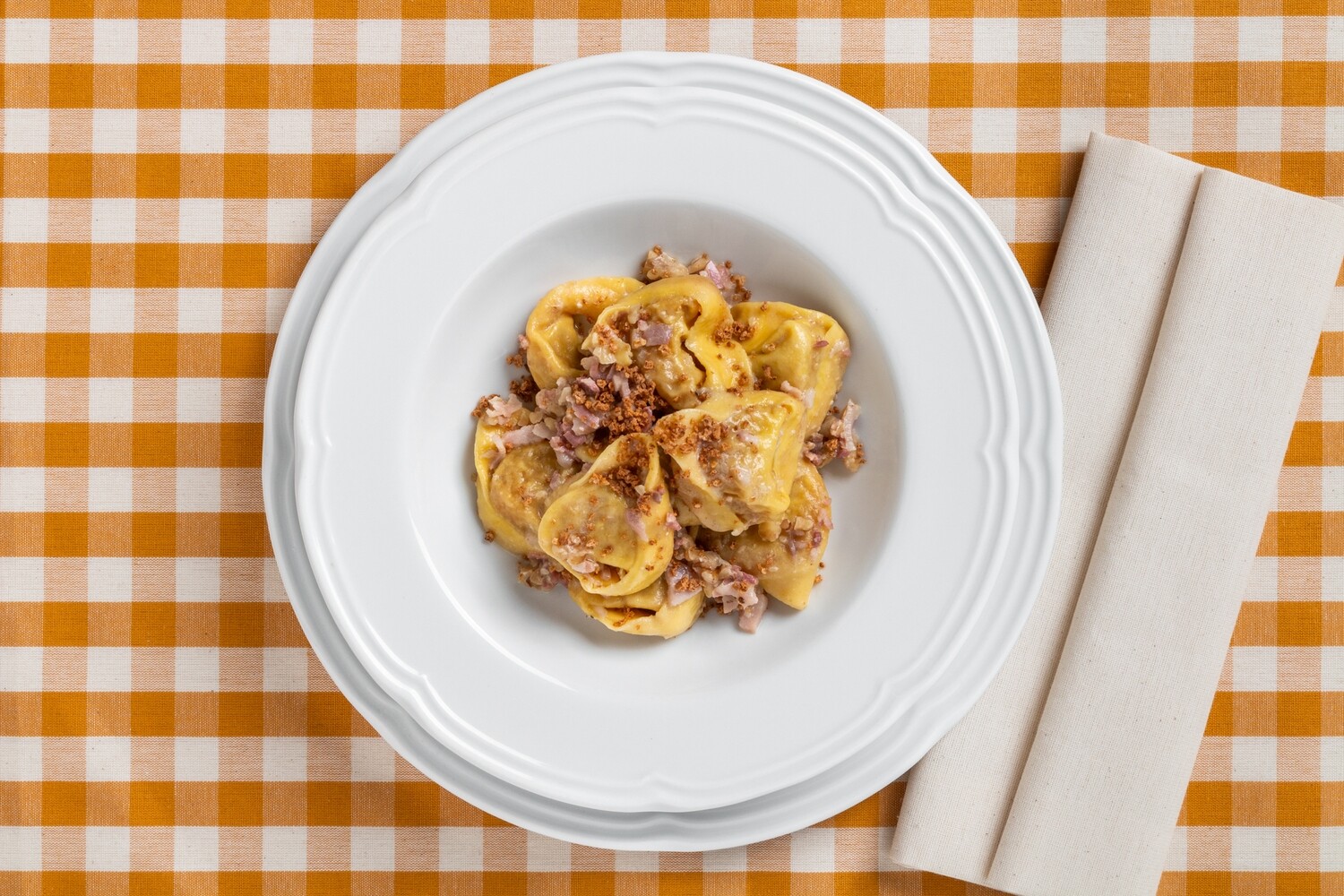 Tortello di zucca alla modenese con noci e pancetta Tortello di zucca alla modenese con noci e pancetta
