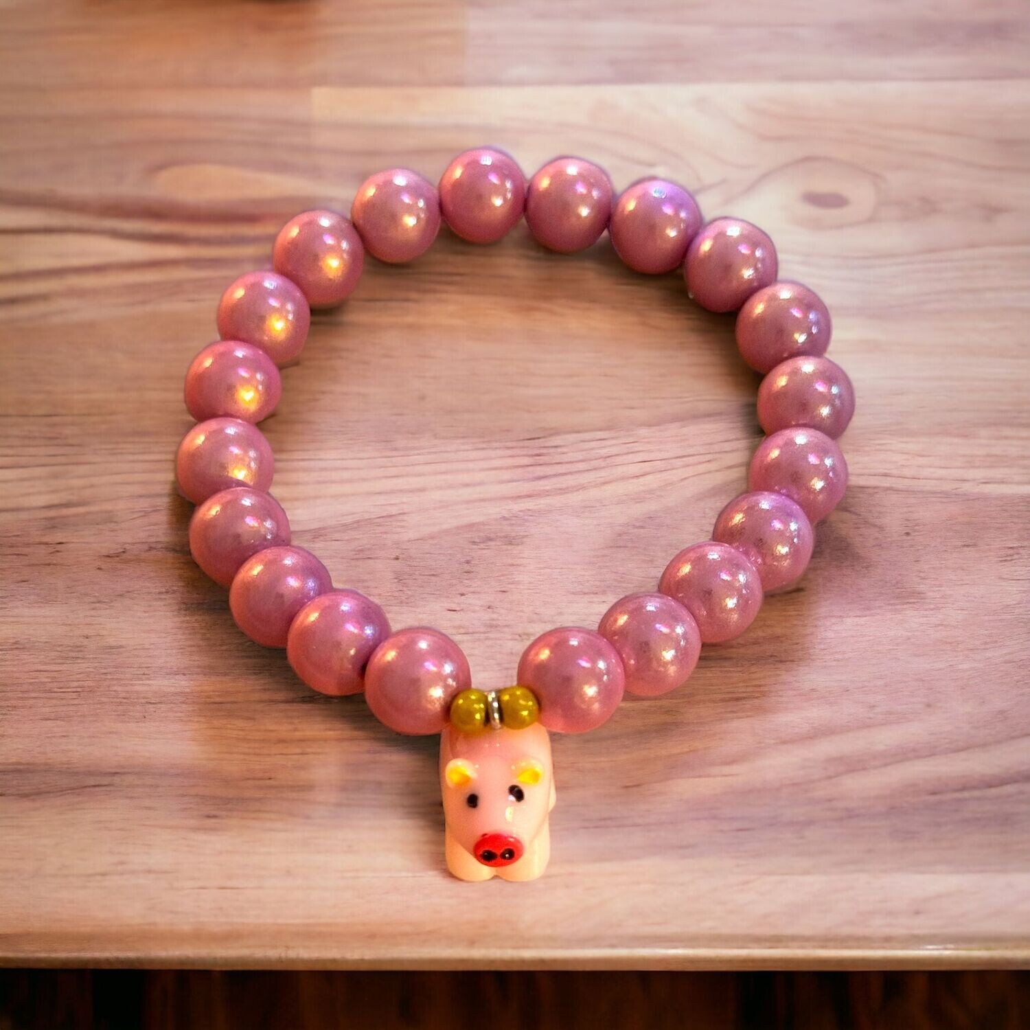 Glücksbringer - Wunderperlenarmband mit Schweinchen in rosa -  Midi