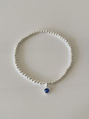 Sterling Silver Stretchy Bracelet With a Saphire Crystal Charm Drop