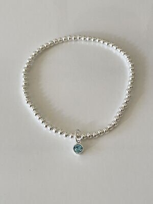 Sterling Silver Stretchy Bracelet With A Aquamarine Crystal Charm Drop