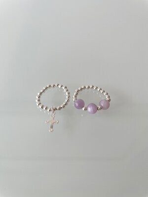 A Pair 0f Sterling Silver Stretchy Rings With A Cross Charm And Kunzite Gemstones.