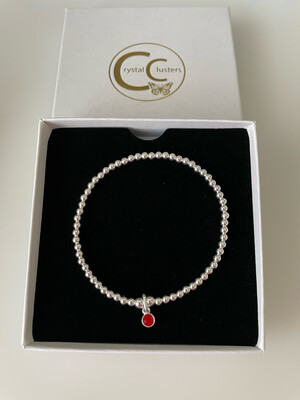 Sterling Silver Stretchy Bracelet With A Ruby Red Crystal Charm Drop