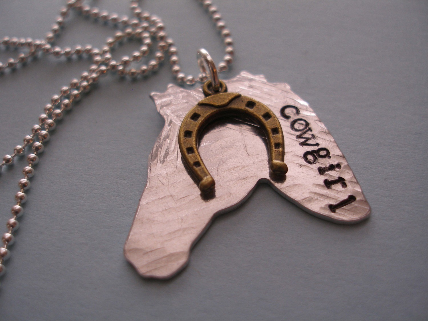 cowgirl horse pendant