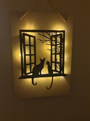 Cats in window silhouette