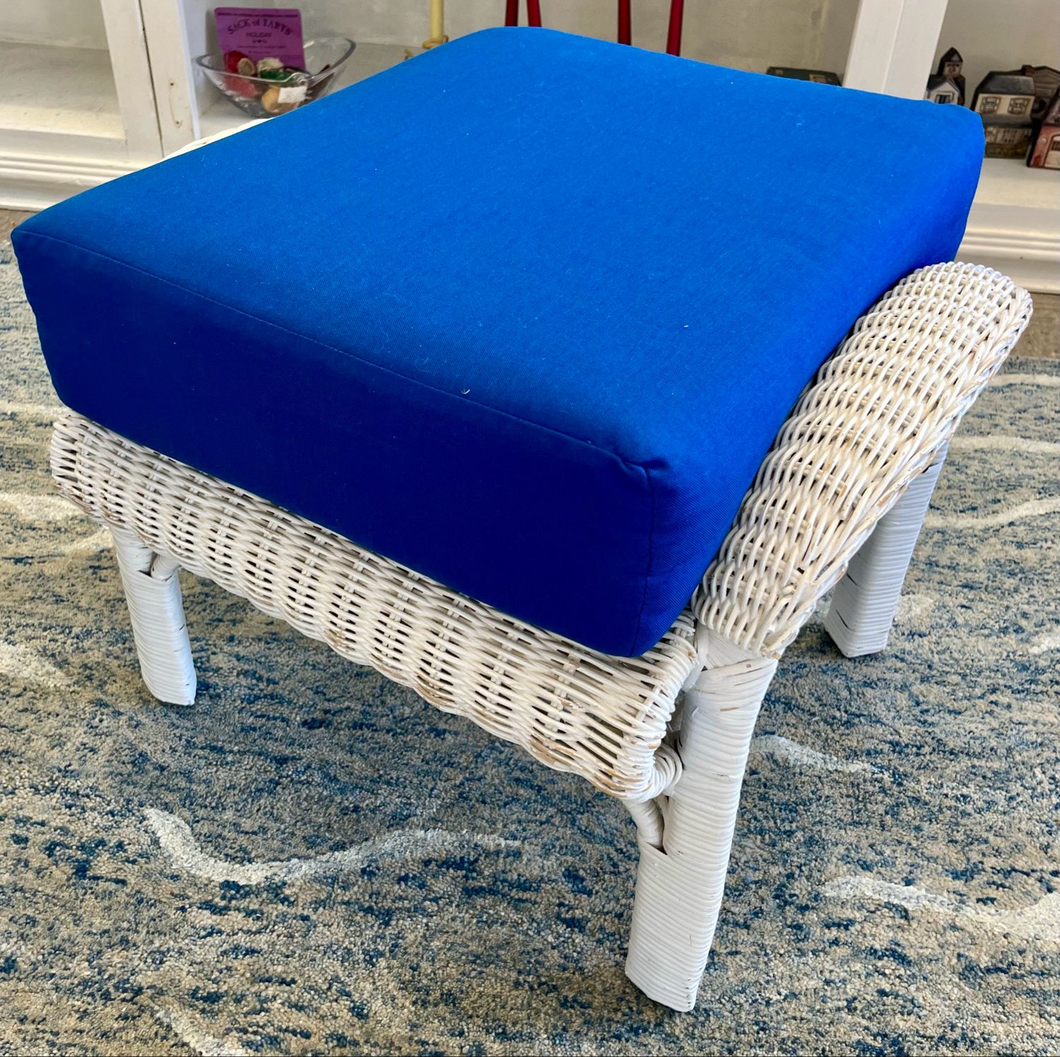 White Wicker Ottoman + Blue Cushion