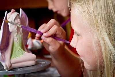 a child painting pottery in stone harbor new jersey