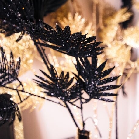BRANCHE DE FEUILLES EXOTIQUES PAILLETTES NOIRES 87CM