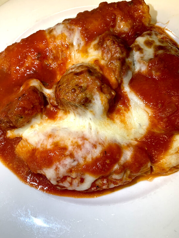 16 Faccia  Manicotti, two meatballs & two stuffed shells