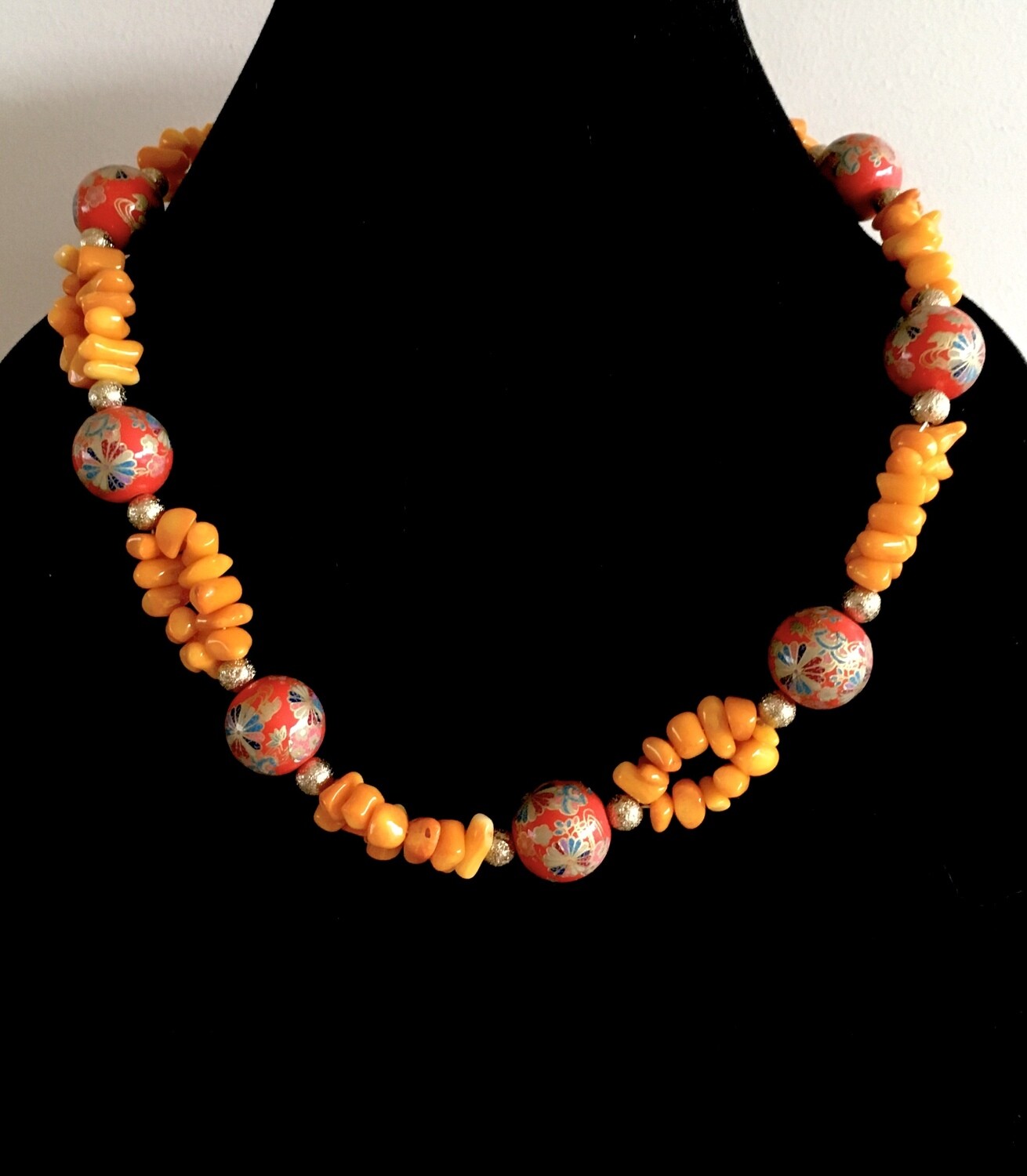 Orange bead and bohemian balls necklace