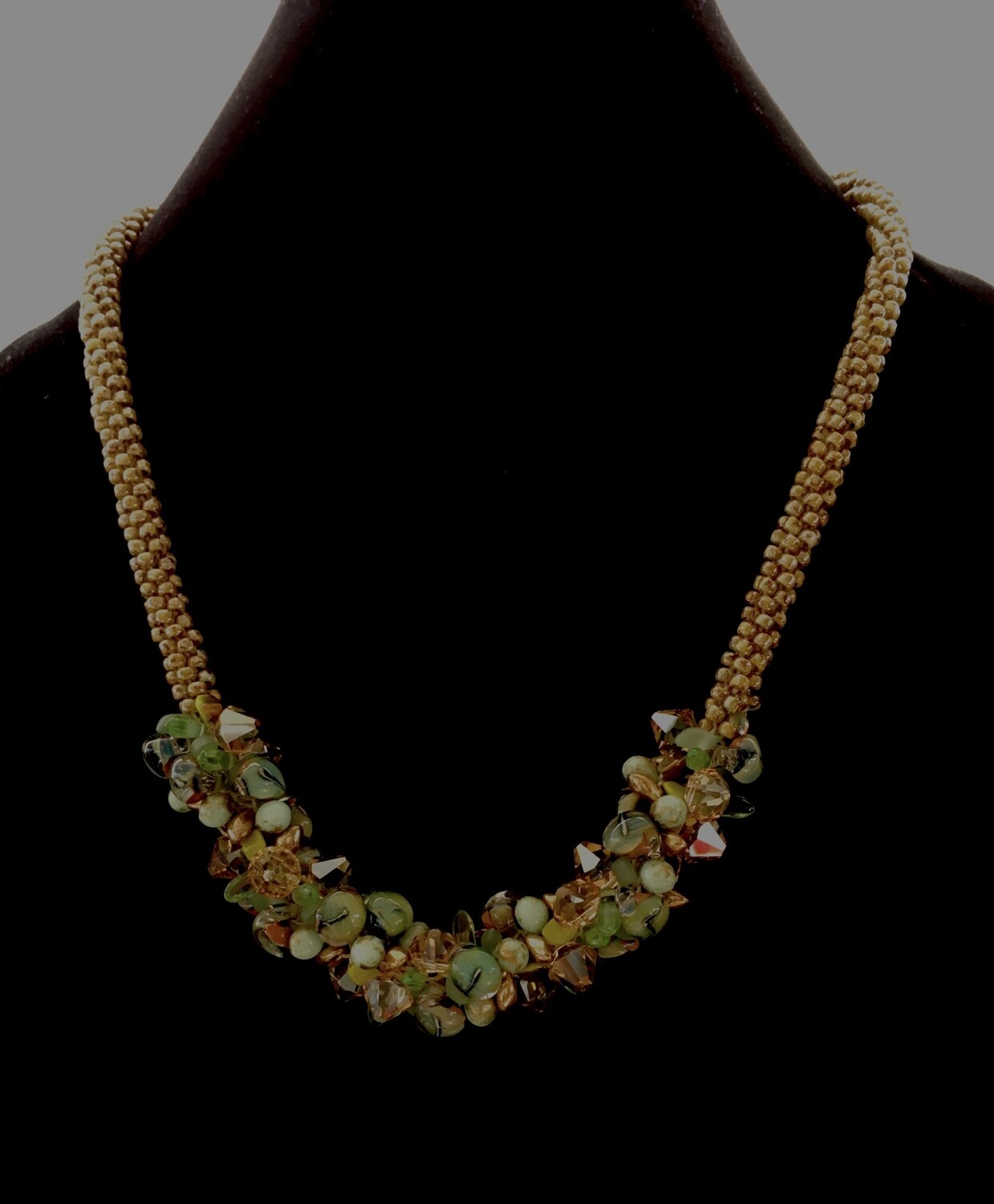 Kumihumo necklace with green floral cluster beads