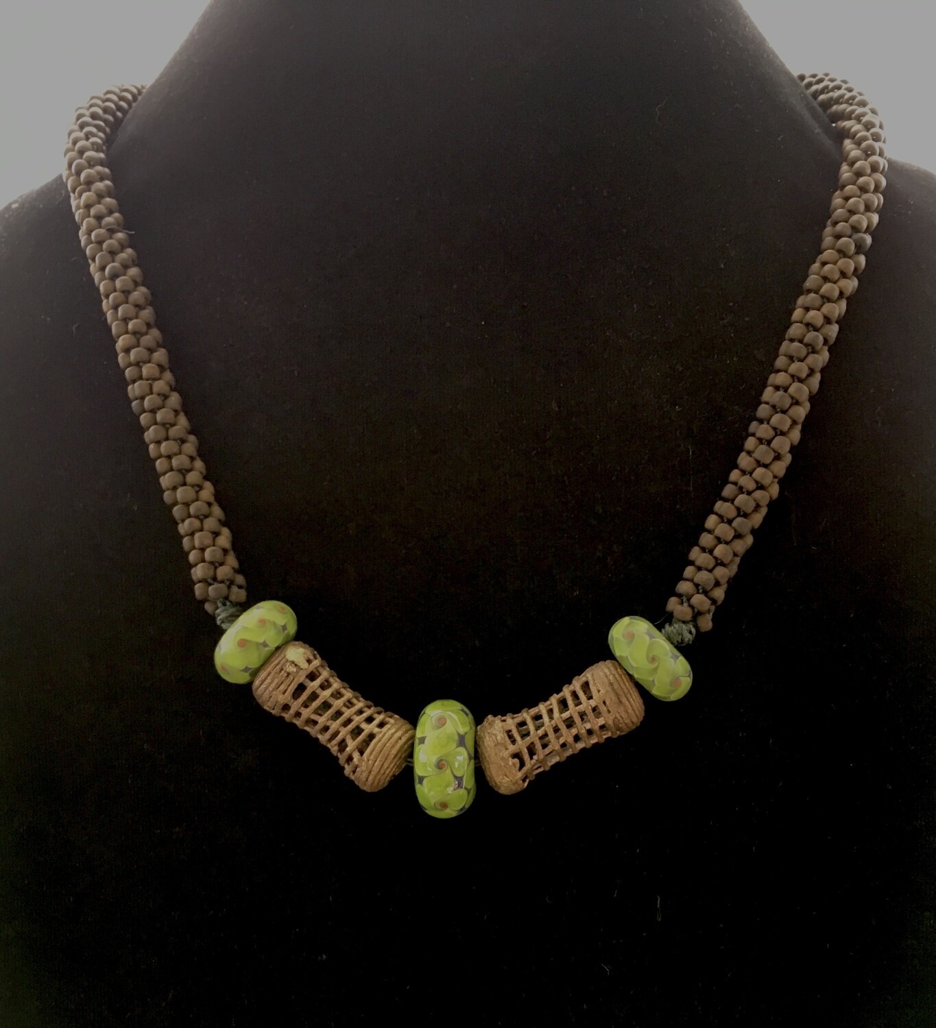 Kumihumo necklace with ethnic bronze and hand made glass beads