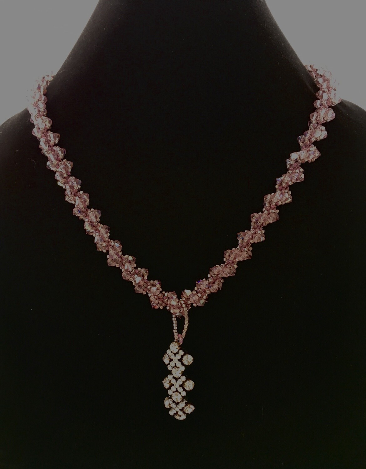 Mauve twisted necklace with crystal pendant