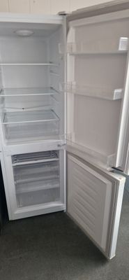 CURRY'S  ESSENTIALS FRIDGE FREEZER 141CM TALL 50CM WIDE MODEL C50BW16