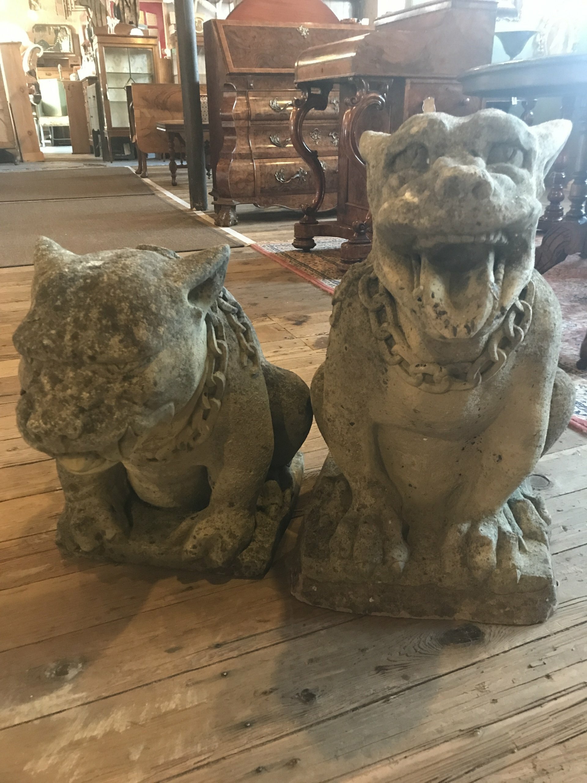 Pair of composite 20th century stone gothic style dogs.