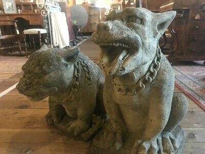 Pair of composite 20th century stone gothic style dogs.