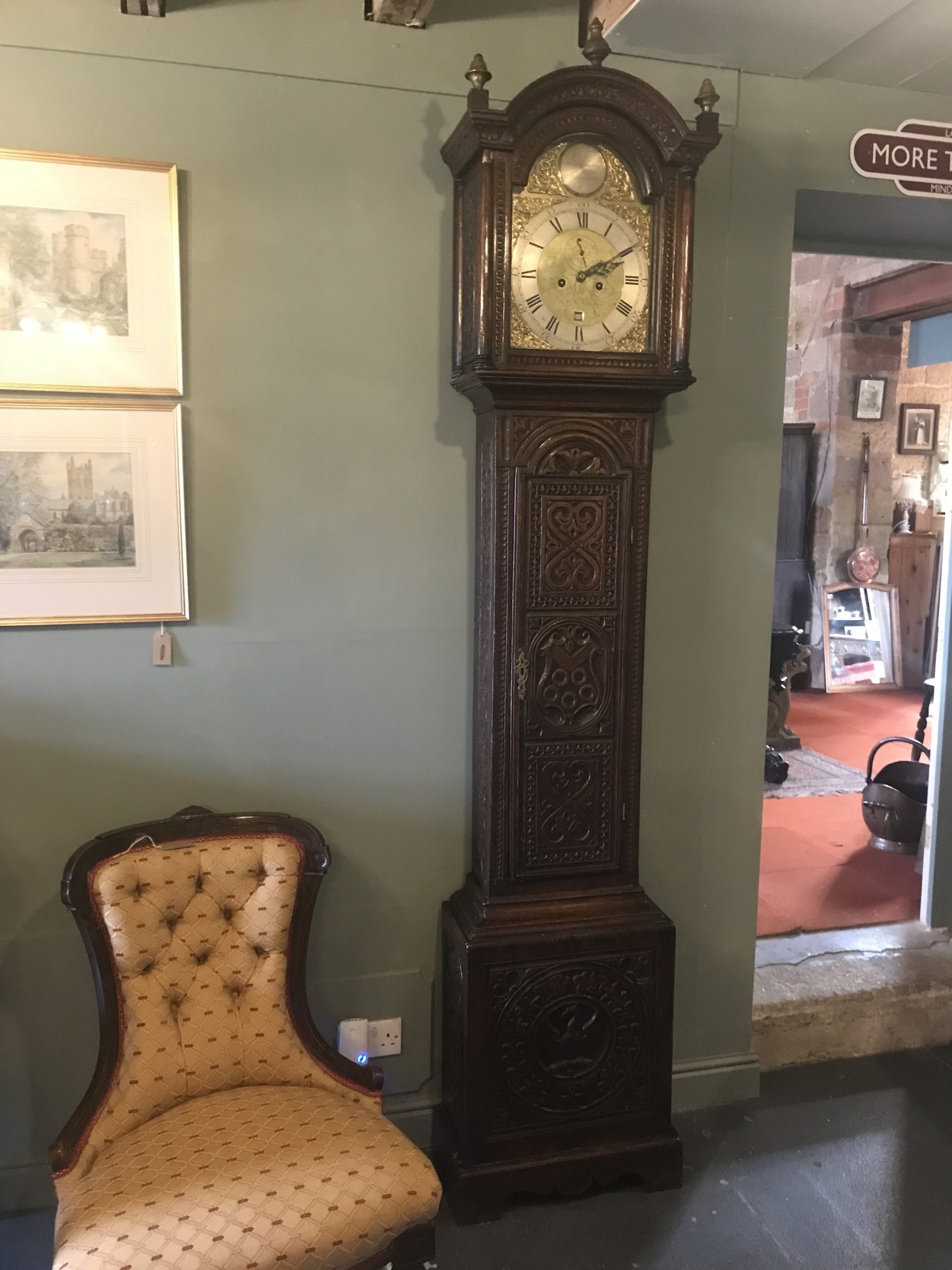 Carved oak long case clock.
