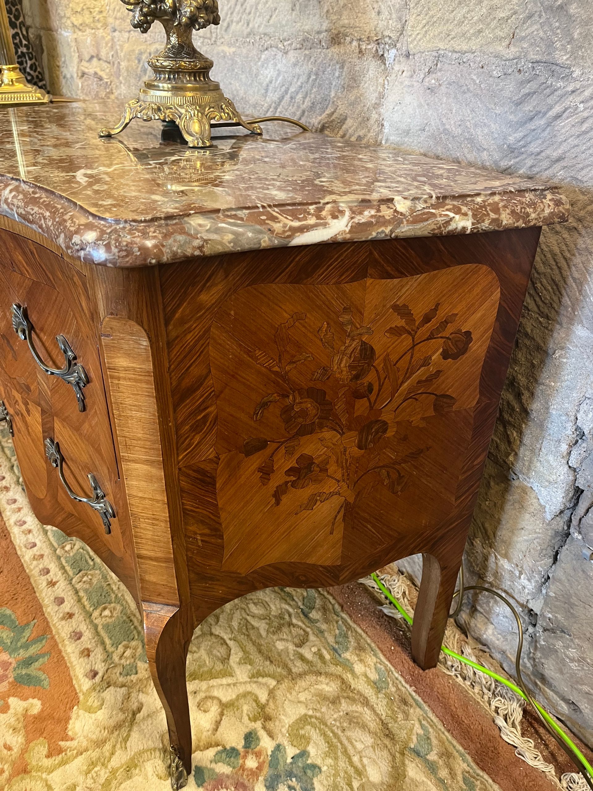 Louis XV-style marquetry commode.