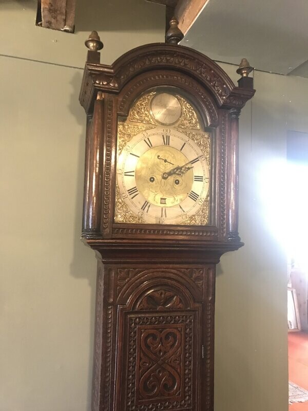 Carved oak long case clock. Carved oak long case clock.