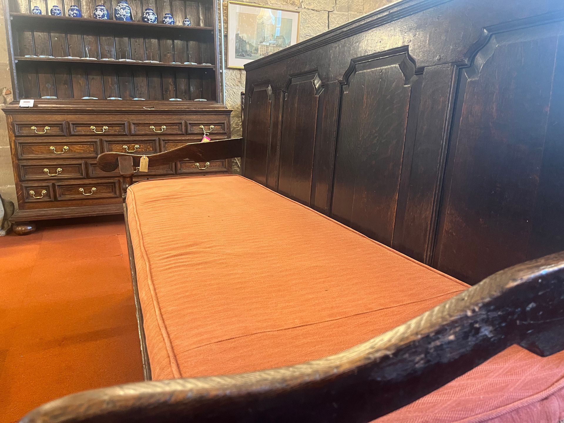 Georgian oak panelled settle with fitted seat cushion, circa 1800