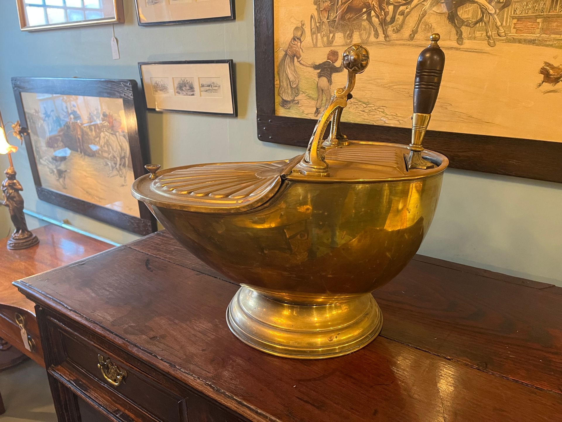Antique brass helmet coal scuttle with matching shovel and darkwood handles