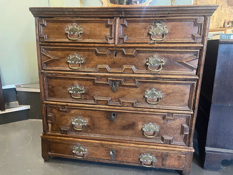 William III period English oak geometric chest on stand
circa 1690