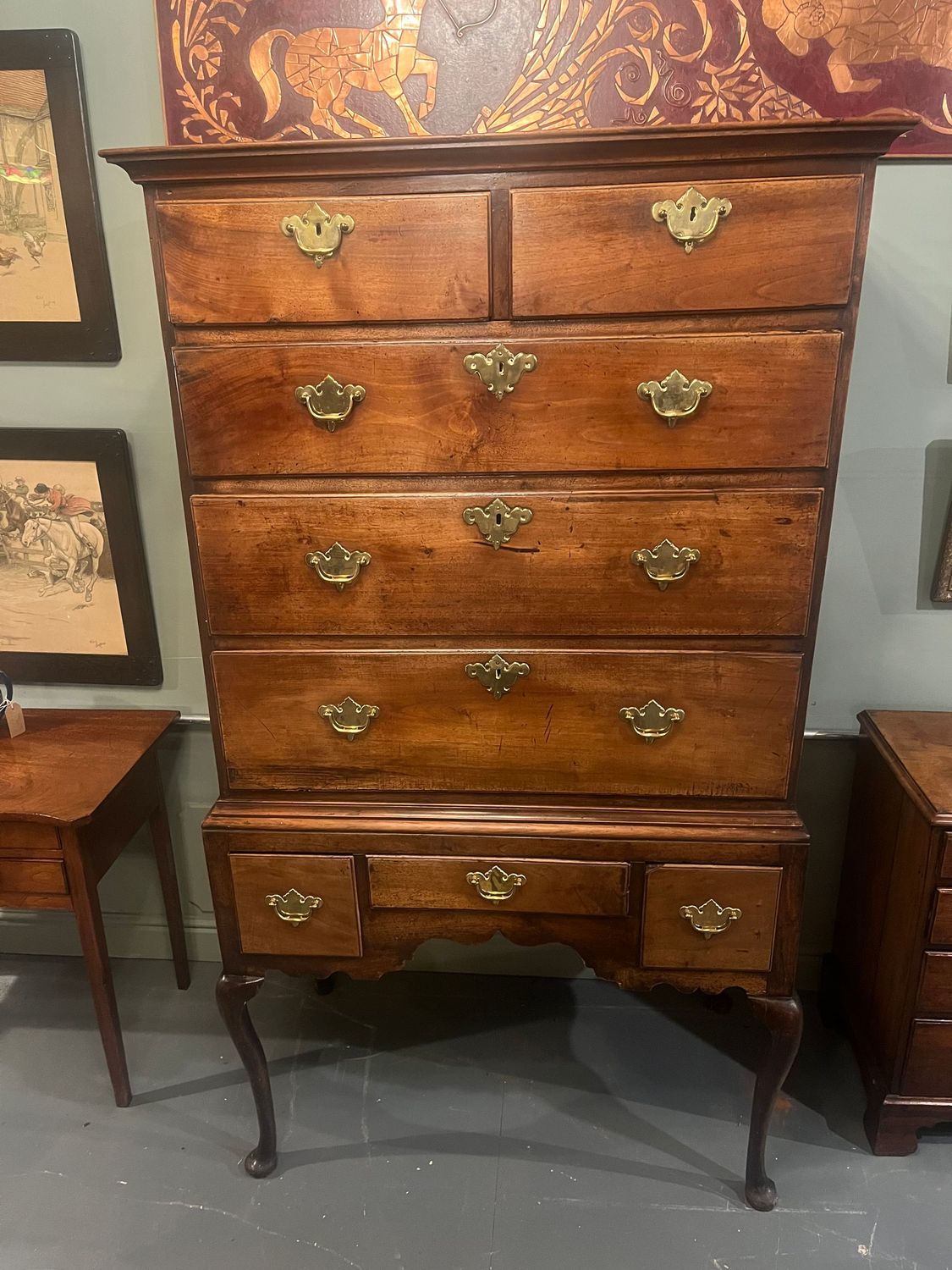 Queen Anne-period English walnut chest on stand with cabriole legs, circa 1710–1720