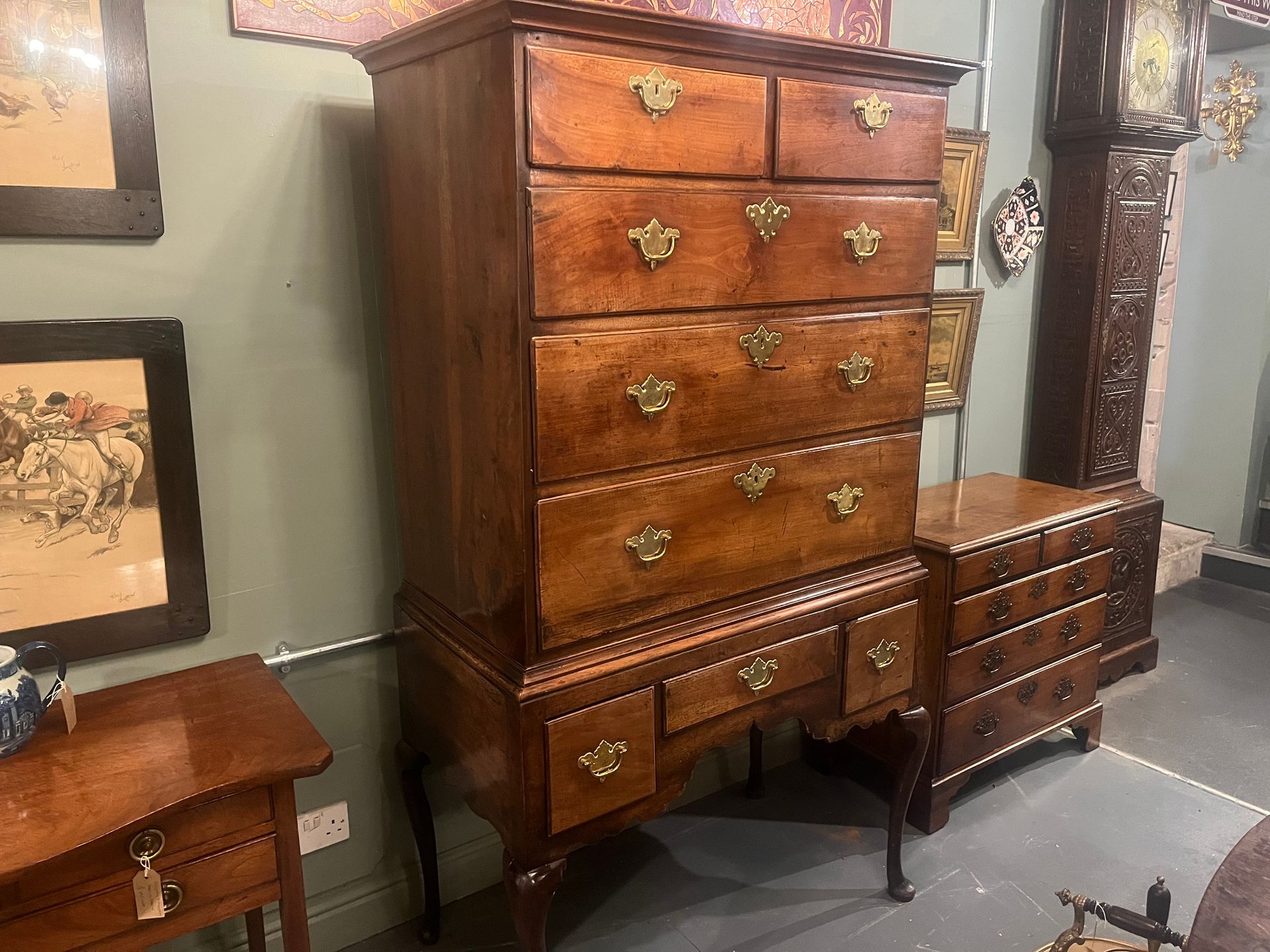 Queen Anne-period English walnut chest on stand with cabriole legs, circa 1710–1720