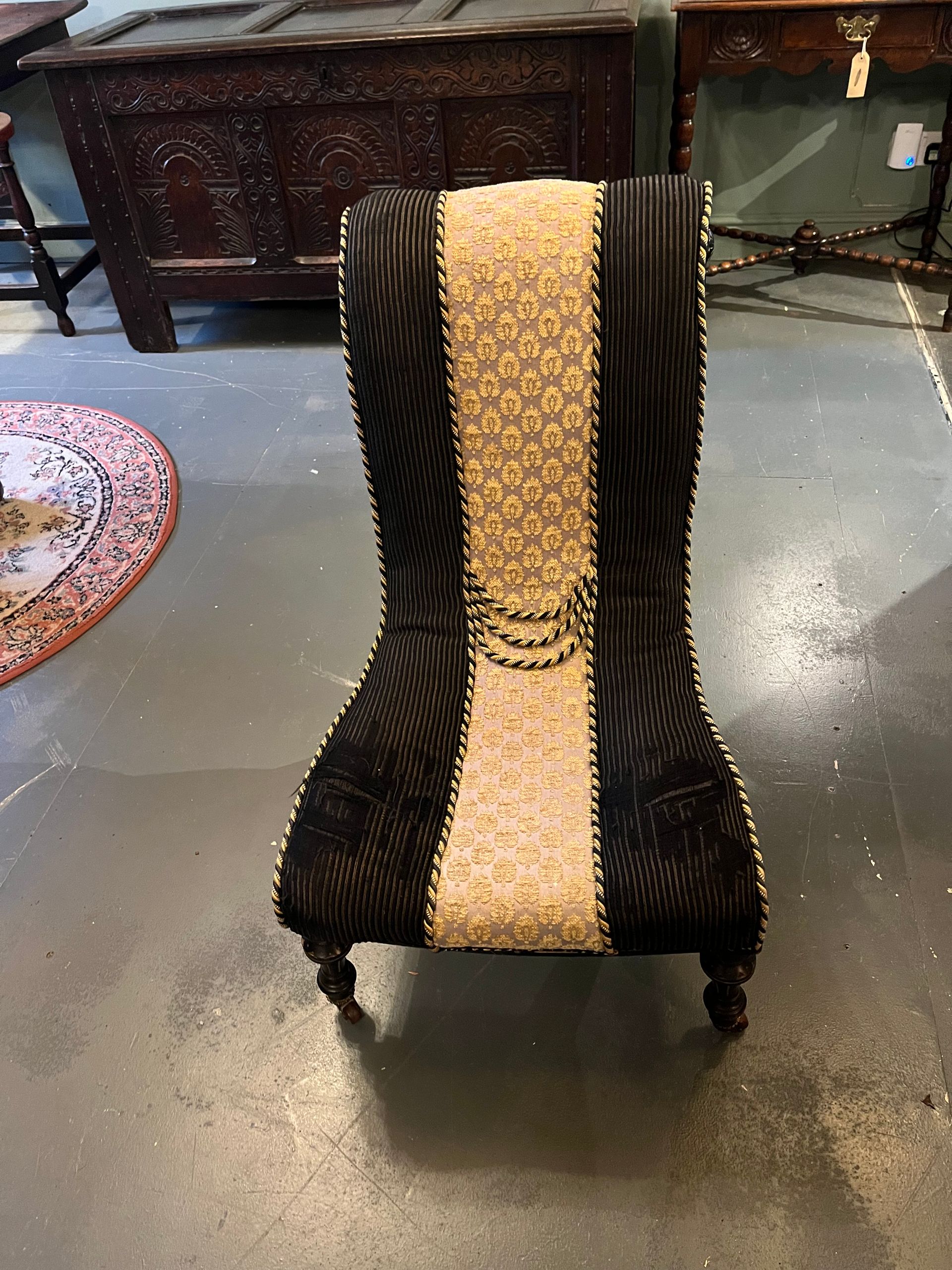 Victorian slipper chair with black and gold upholstery