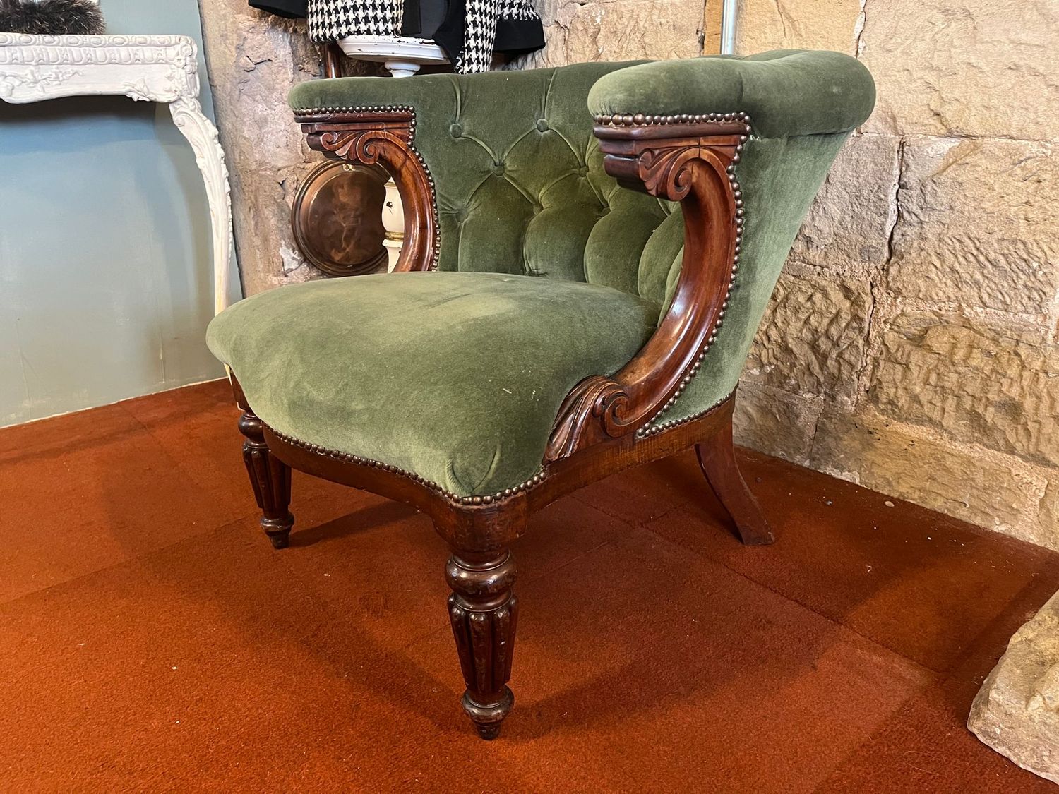 Victorian Carved Wood Tub Armchair in Green Upholstery Victorian tub armchair with green upholstery, carved scroll arms and turned front legs