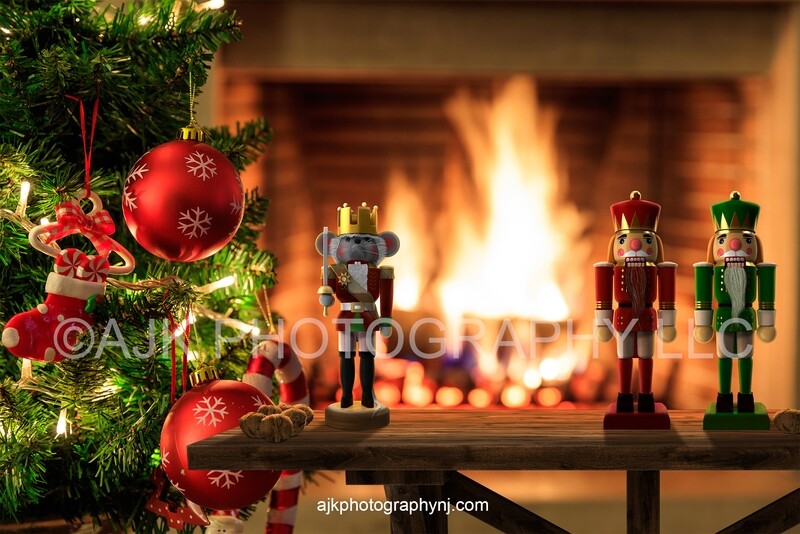 Nutcrackers on table with walnuts in front of fireplace Christmas digital backdrop